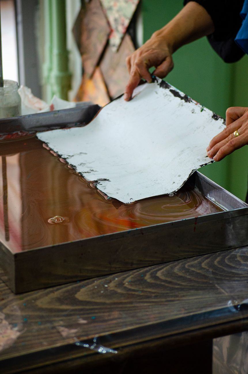 Low-moisture papermaking